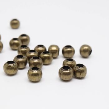 Metalne perle/razdelnici 3 mm. Pakovanje sadrži 300 komada - boja antik bronze .(100431)