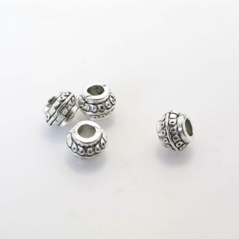 Metalna perla 8,5 x 6,5  mm, rupa oko 3.5 mm- boja antik srebra ( R154AS )