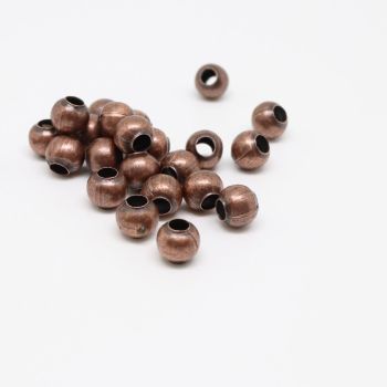 Metalne perle/razdelnici 6 mm. Pakovanje sadrži 100 komada - boja antik bakar .(100444)